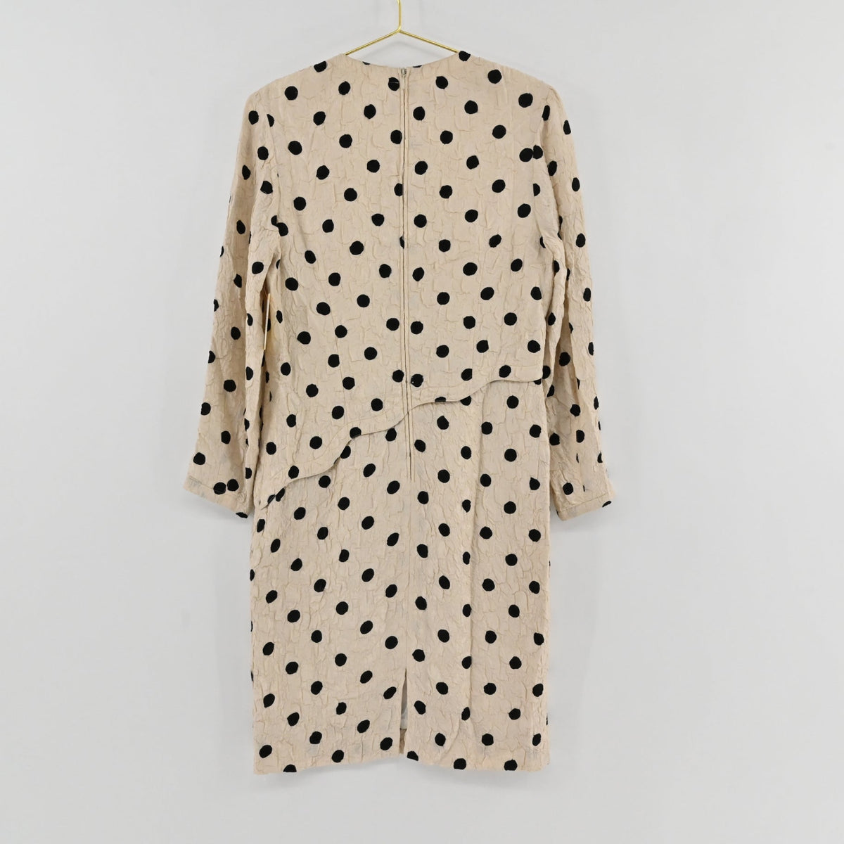 Lynn's Closet Boutique vintage Louis Feraud cream and black polka dot textured long sleeve dress, back view.