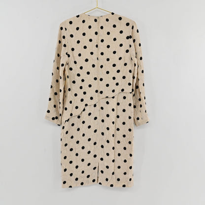 Lynn's Closet Boutique vintage Louis Feraud cream and black polka dot textured long sleeve dress, back view.