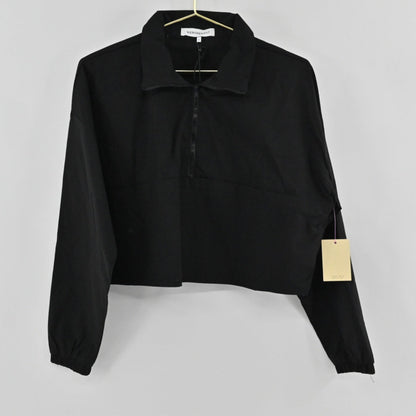 Lynn's Closet Boutique Revolve WeWoreWhat black cropped jacket with a half-zip front, collar, and elasticated cuffs.