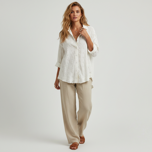 Lynn's Closet Boutique Free People white eyelet button-down shirt worn by a model with beige linen trousers
