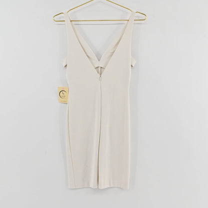 Lynn's Closet Boutique white Amanda Uprichard mini dress with deep V-neck and cold-shoulder detail on a gold hanger