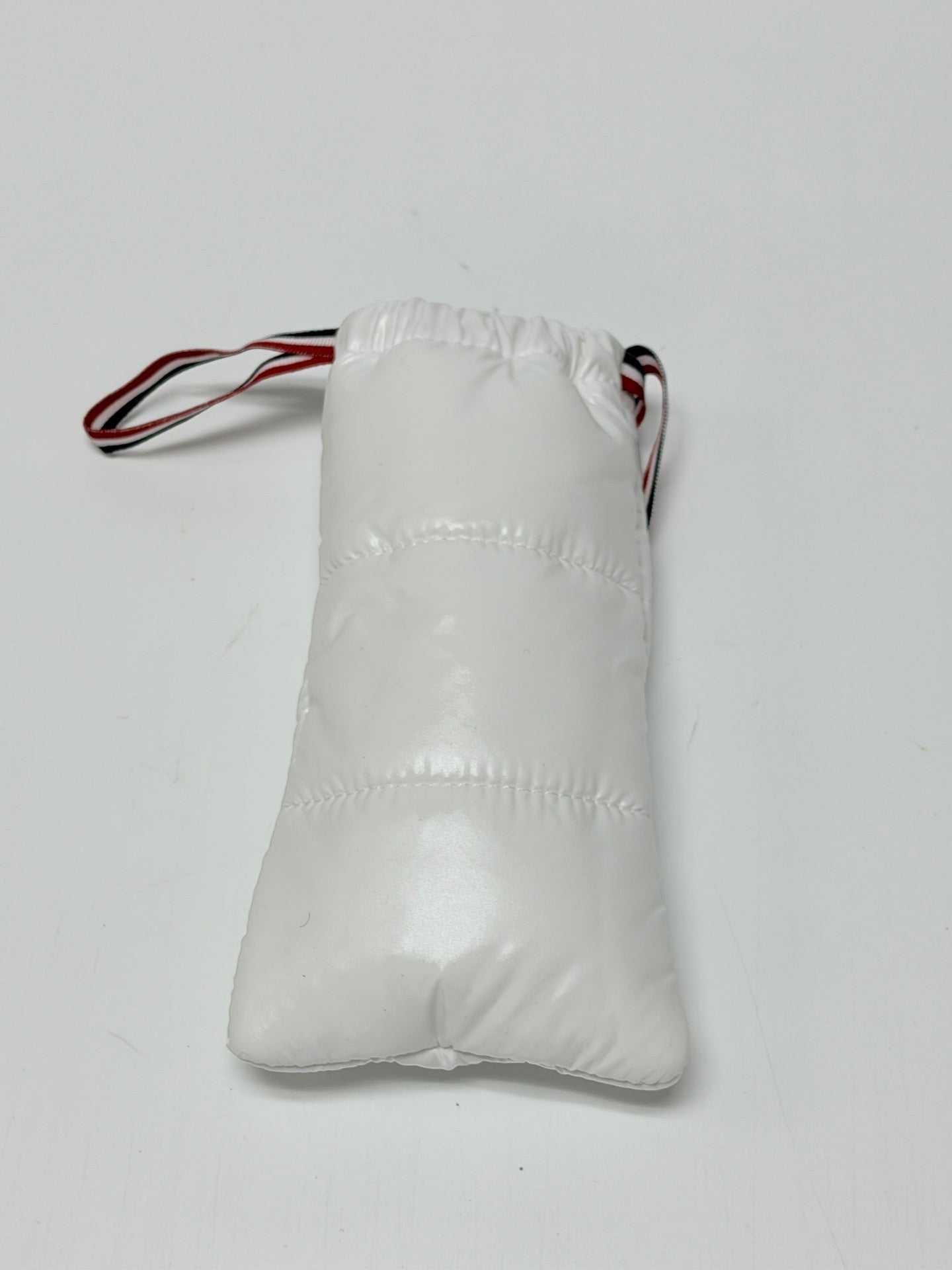 Lynn's Closet Boutique white quilted nylon protective pouch for Moncler sunglasses with red, white, and blue trim.