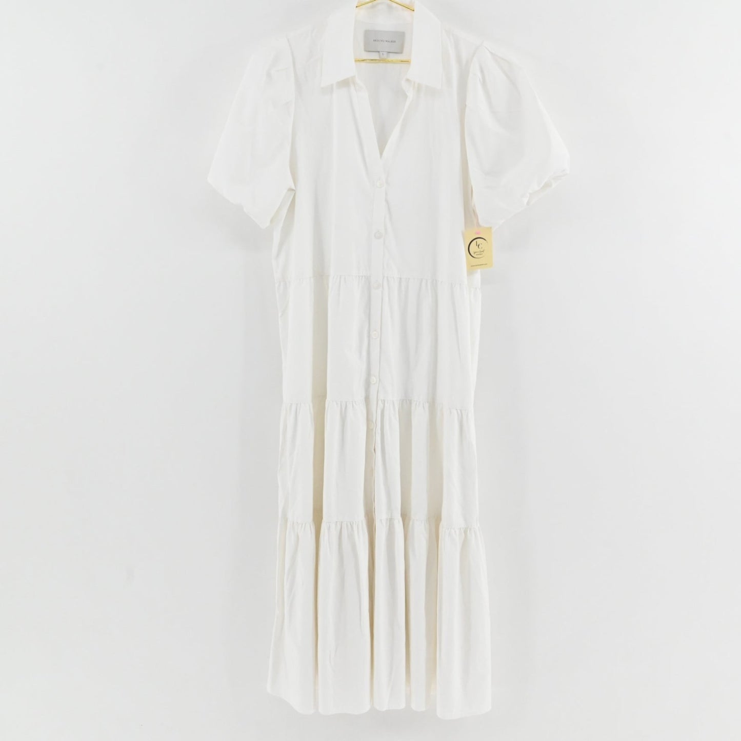 Lynn's Closet Boutique white midi tiered dress with a collared neckline, button-down front, and puff sleeves.