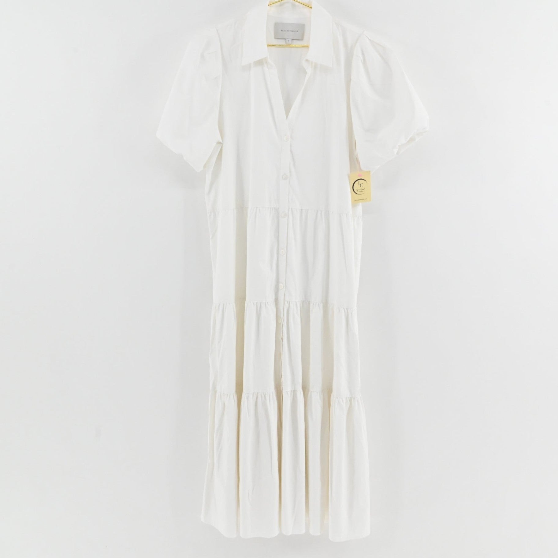 Lynn's Closet Boutique white midi tiered dress with a collared neckline, button-down front, and puff sleeves.