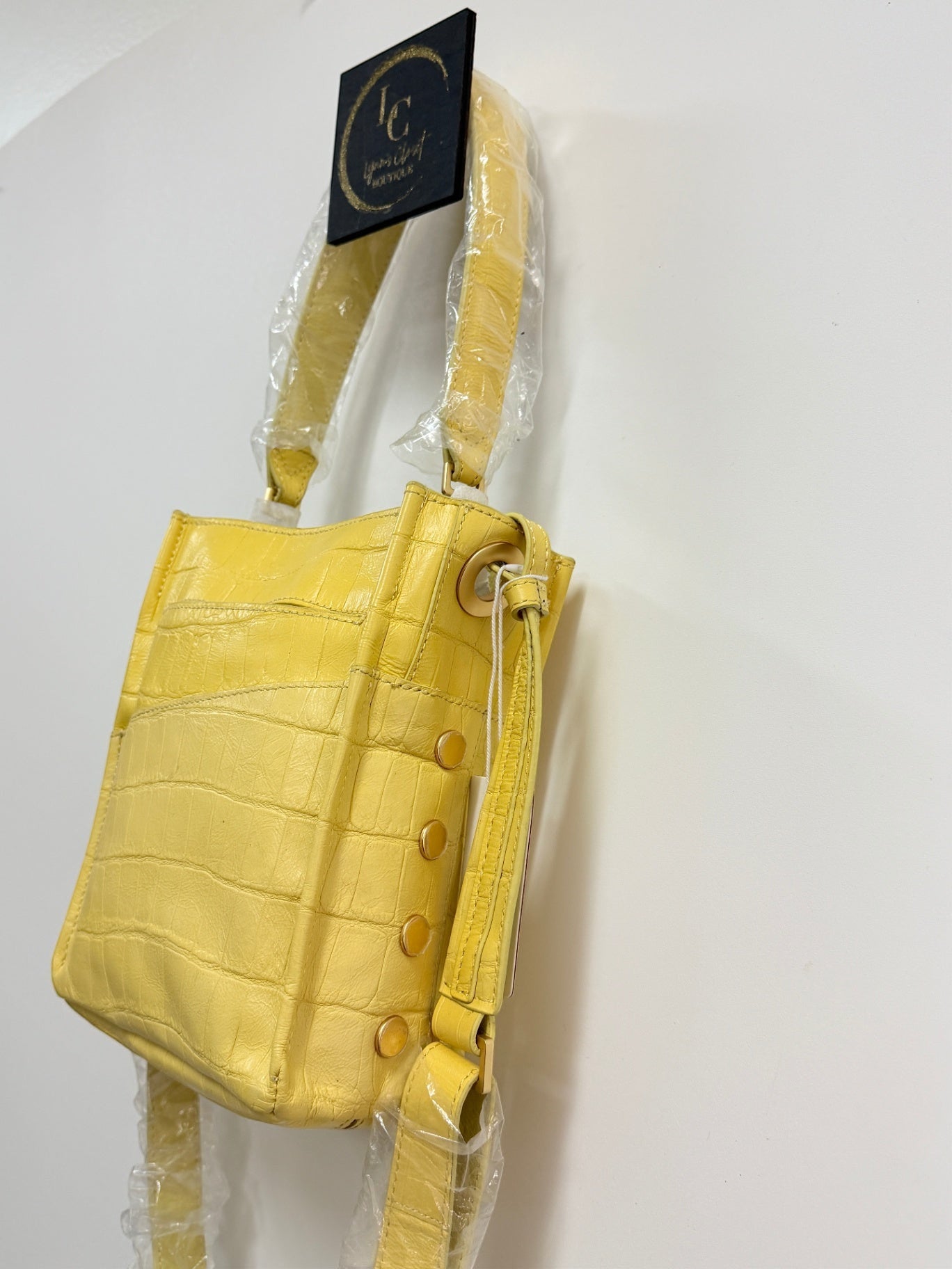 Lynn's Closet Boutique Hammitt Sunstruck yellow leather crossbody bag with crocodile-embossed texture and gold studs.