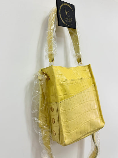 Lynn's Closet Boutique yellow crocodile-embossed leather crossbody bag with exterior slip pocket and gold hardware.
