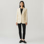Model wearing a Zara light yellow tailored blazer from Lynn's Closet Boutique with black trousers and loafers.