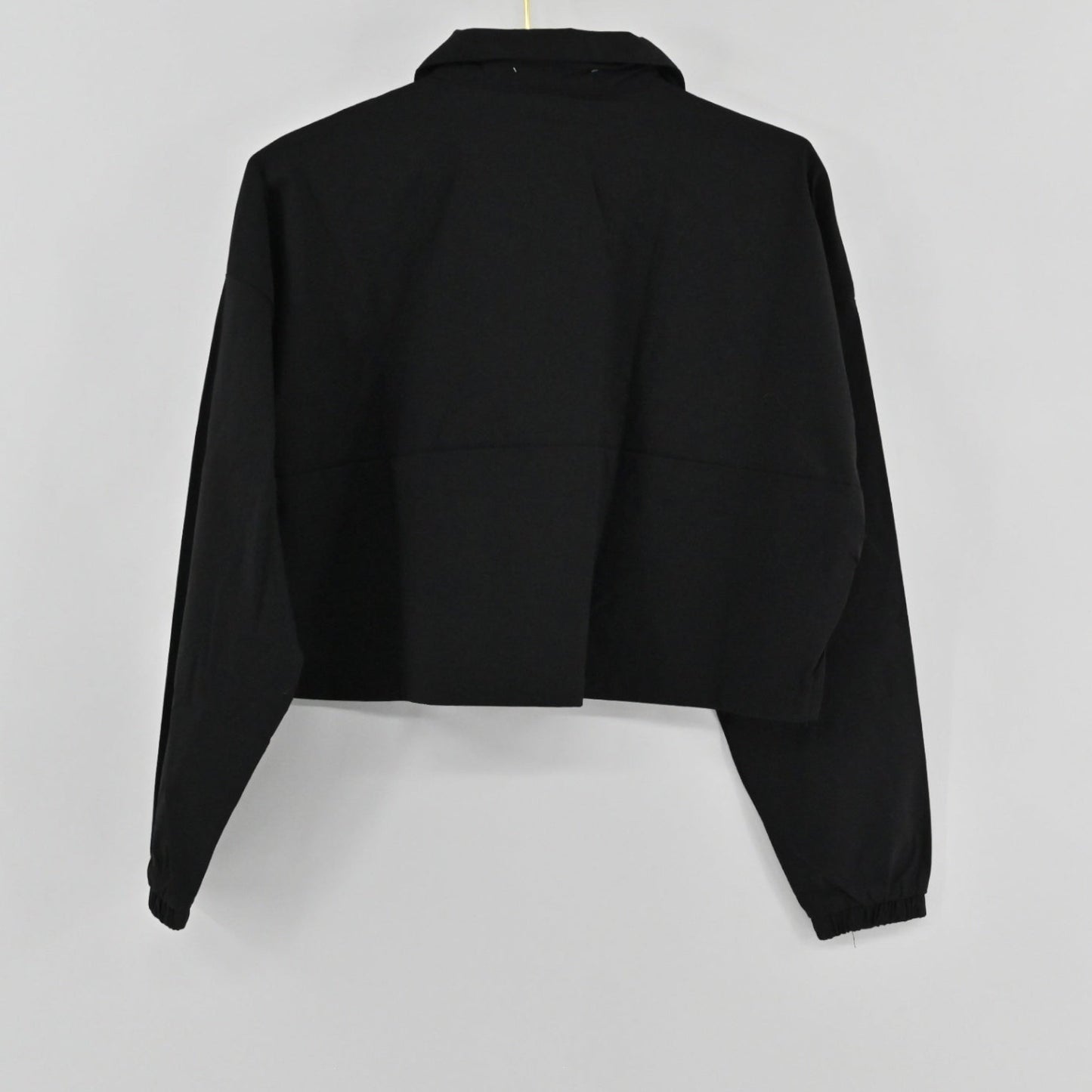 Lynn's Closet Boutique WeWoreWhat black cropped jacket with a collar, half-zip front, and elasticated cuffs.