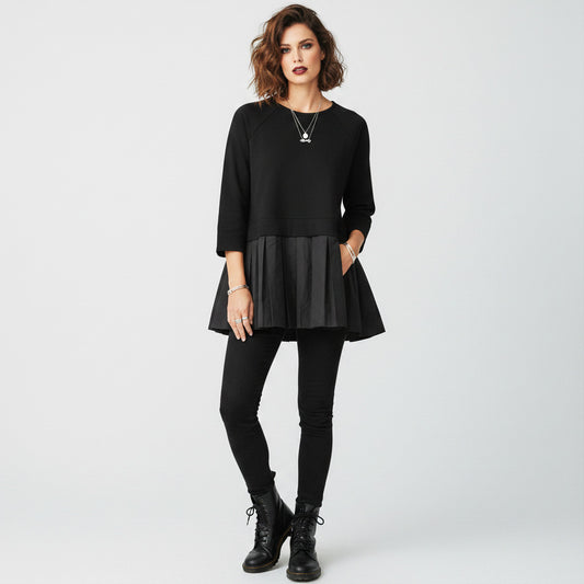 Lynn's Closet Boutique black COS peplum top with crew neck and 3/4 sleeves, size M. Features a pleated skirt detail.