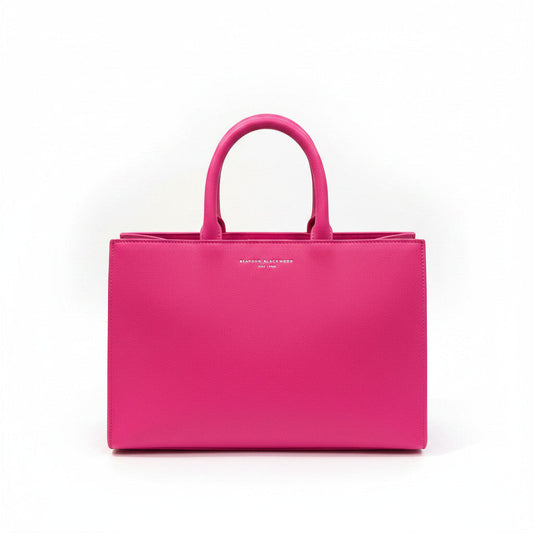Lynn's Closet Boutique Brandon Blackwood hot pink leather tote bag with top handles and silver logo.