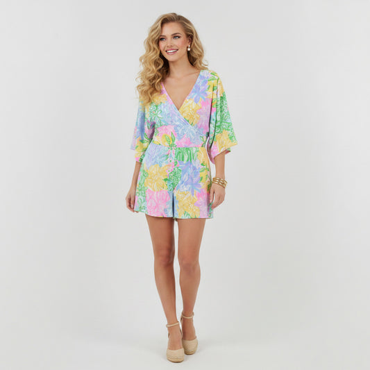 Lynn's Closet Boutique Lilly Pulitzer Parigi Romper in pastel floral print, size XS. Features a V-neck, wrap-style bodice, and elasticated waist.