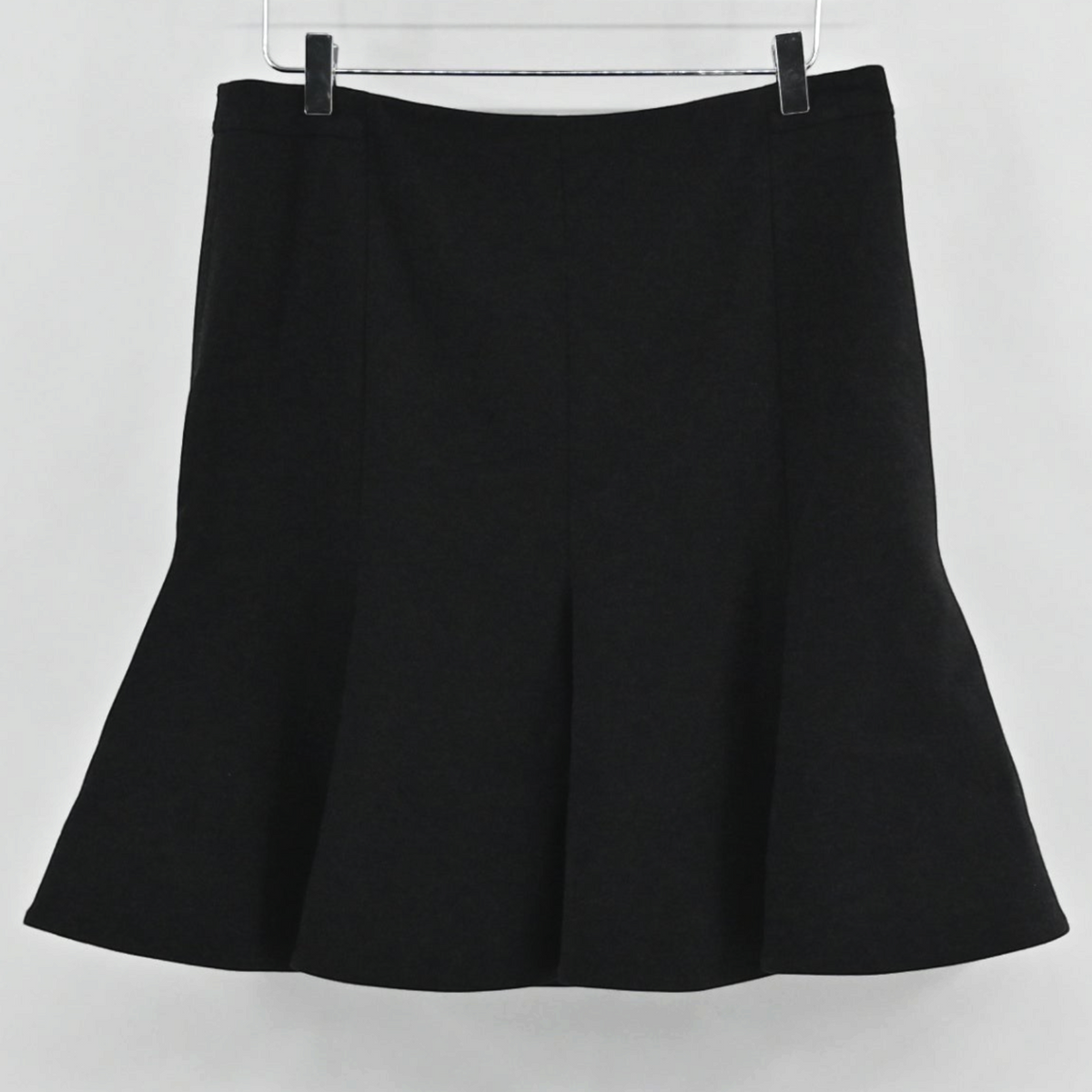 Lynn's Closet Boutique Akris Punto black skater skirt with a flared godet hemline hanging on a hanger