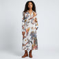 Lynn's Closet Boutique Ala von Auersperg white shirt dress with a colorful feather print, worn by a model.