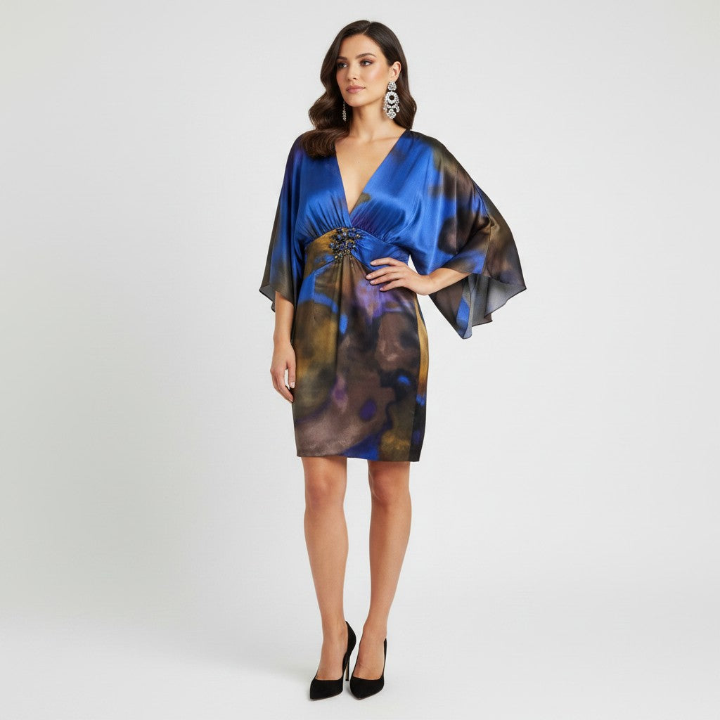 Model wearing a Lynn's Closet Boutique Y2K Alberto Makali blue silk dress with kimono sleeves and beaded waist detail.