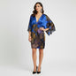 Model wearing a Lynn's Closet Boutique Y2K Alberto Makali blue silk dress with kimono sleeves and beaded waist detail.