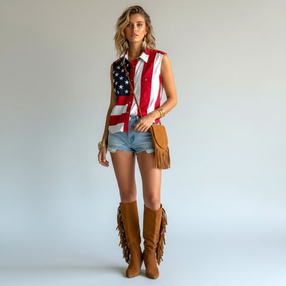 Lynn's Closet Boutique Scully American flag print sleeveless button-up shirt with denim shorts and fringe boots.