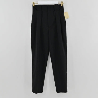 Lynn's Closet Boutique Anine Bing black high-waisted tapered trousers with front pleats hanging on a hanger.