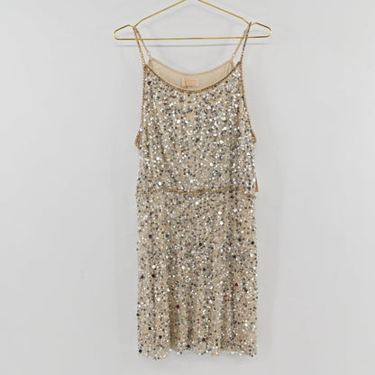 Lynn's Closet Boutique Anthropologie Verb champagne sequin shift dress with spaghetti straps hanging on a gold hanger