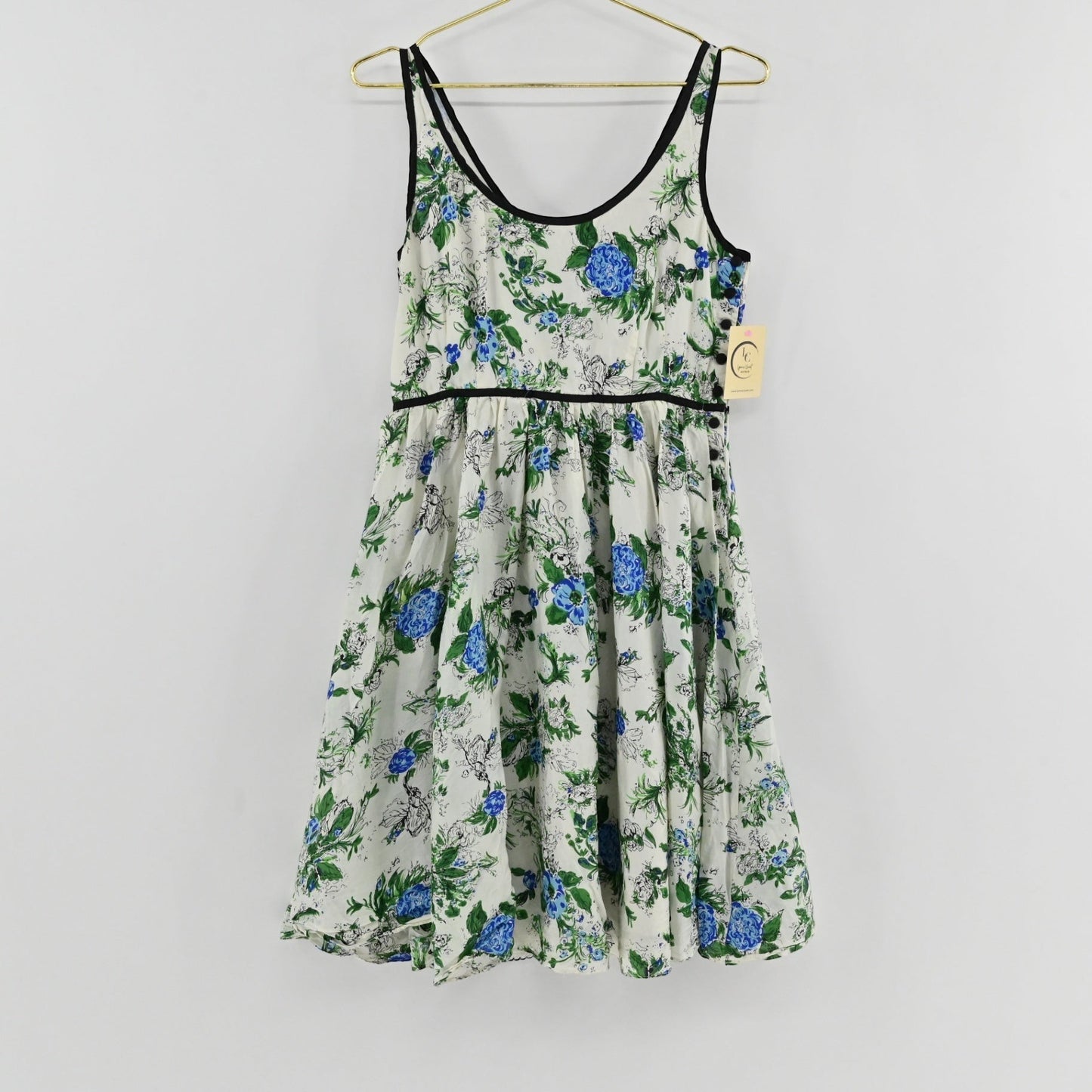 Lynn's Closet Boutique Anthropologie silk floral dress with blue and green botanical print and black trim detailing.