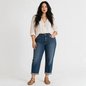 Model wearing Lynn's Closet Boutique Anthropologie Pilcro high-rise tapered jeans with patch pockets and cuffed hems