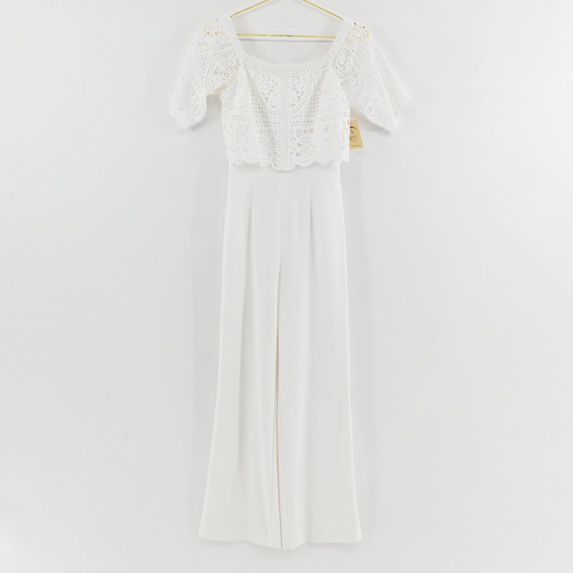 Lynn's Closet Boutique Antonio Melani white wide-leg jumpsuit with off-the-shoulder crochet lace bodice