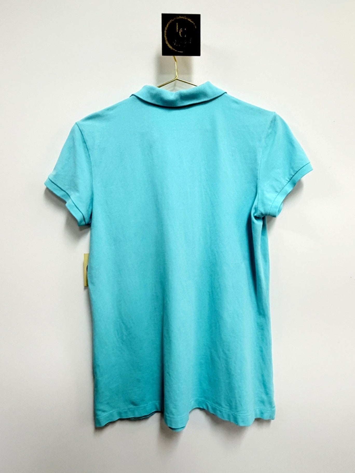 Back view of a Lynn's Closet Boutique Lilly Pulitzer aqua blue polo shirt with short sleeves and a classic collar.