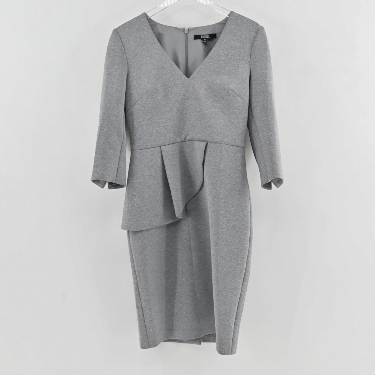 Lynn's Closet Boutique Badgley Mischka heather grey scuba sheath dress with V-neck, 3/4 sleeves, and peplum waist.