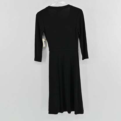 Lynn's Closet Boutique BCBGMaxAzria black wrap dress with three-quarter sleeves shown from the back on a hanger.