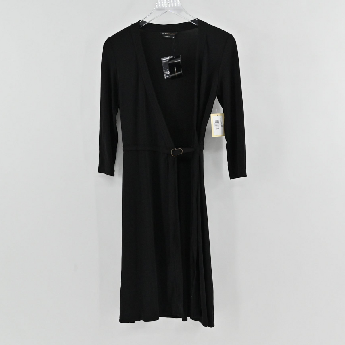Lynn's Closet Boutique BCBGMaxAzria black wrap dress with three-quarter sleeves and a minimalist waist buckle detail.