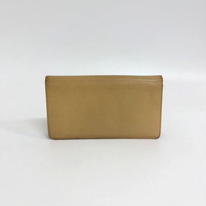 Lynn's Closet Boutique pre-owned beige leather Chanel bi-fold wallet viewed from the back
