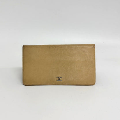 Lynn's Closet Boutique pre-owned beige leather Chanel bi-fold wallet with silver CC logo hardware