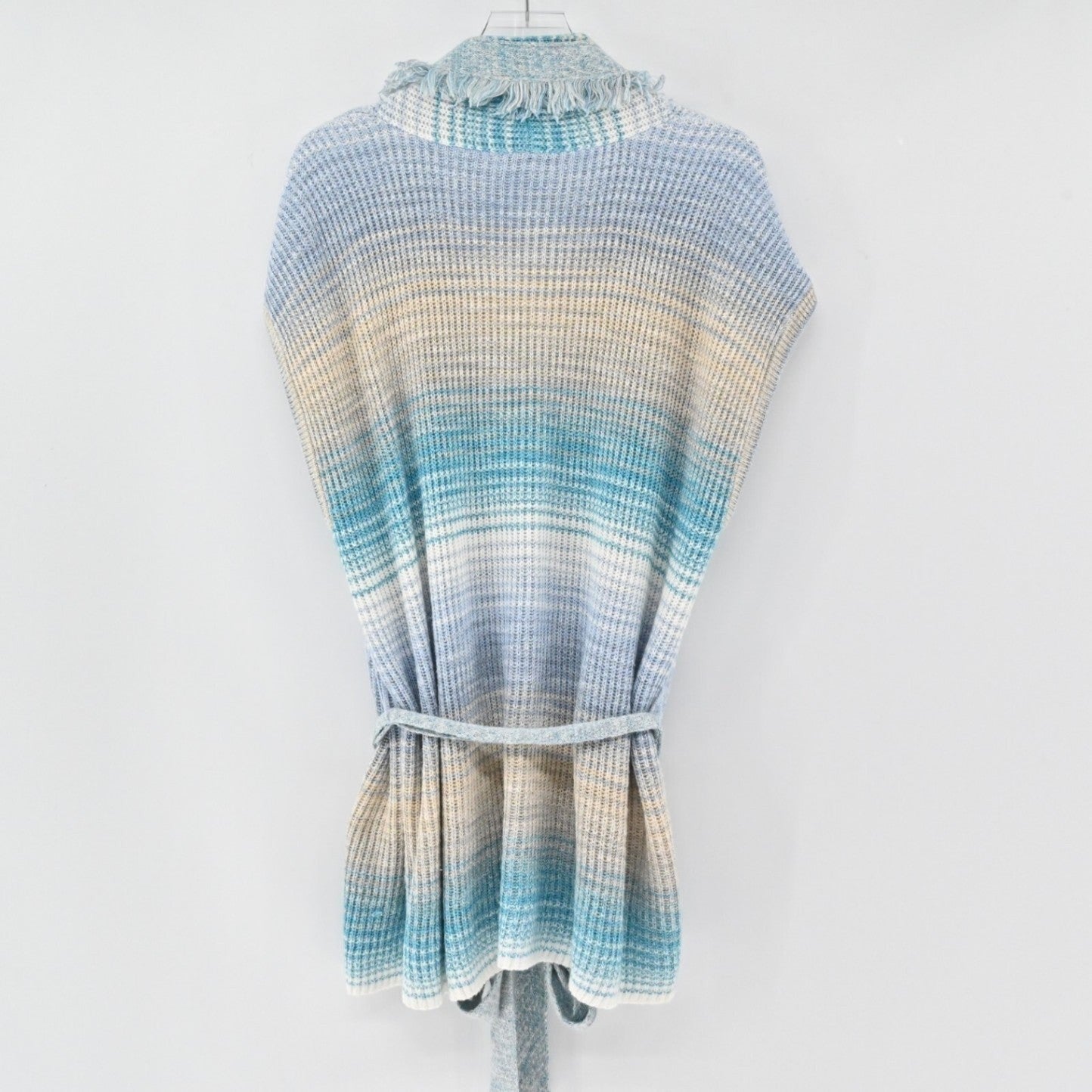 Lynn's Closet Boutique sleeveless knit cardigan in a blue, cream, and sand gradient with fringe collar and waist belt.