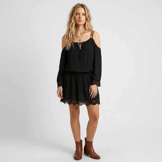 Lynn's Closet Boutique black bohemian cold-shoulder dress with lace trim and spaghetti straps worn with ankle boots