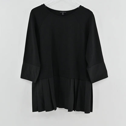 Lynn's Closet Boutique black COS peplum top with round neck and three-quarter raglan sleeves on a hanger.