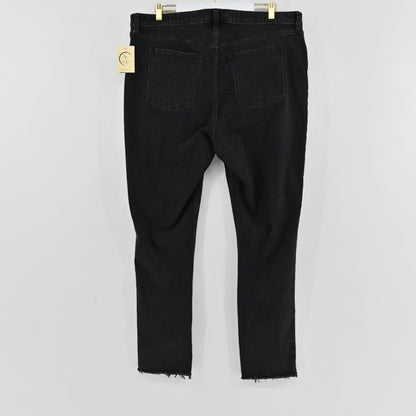 Lynn's Closet Boutique A&F Curve Love black denim pants featuring a high-rise waist and raw-edge hem, back view.