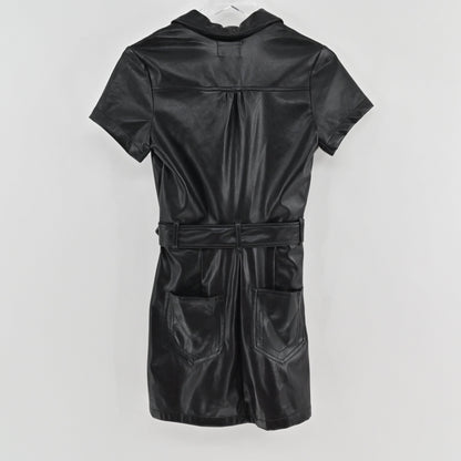 Lynn's Closet Boutique Show Me Your Mumu black faux leather mini dress with a belted waist and back pockets.