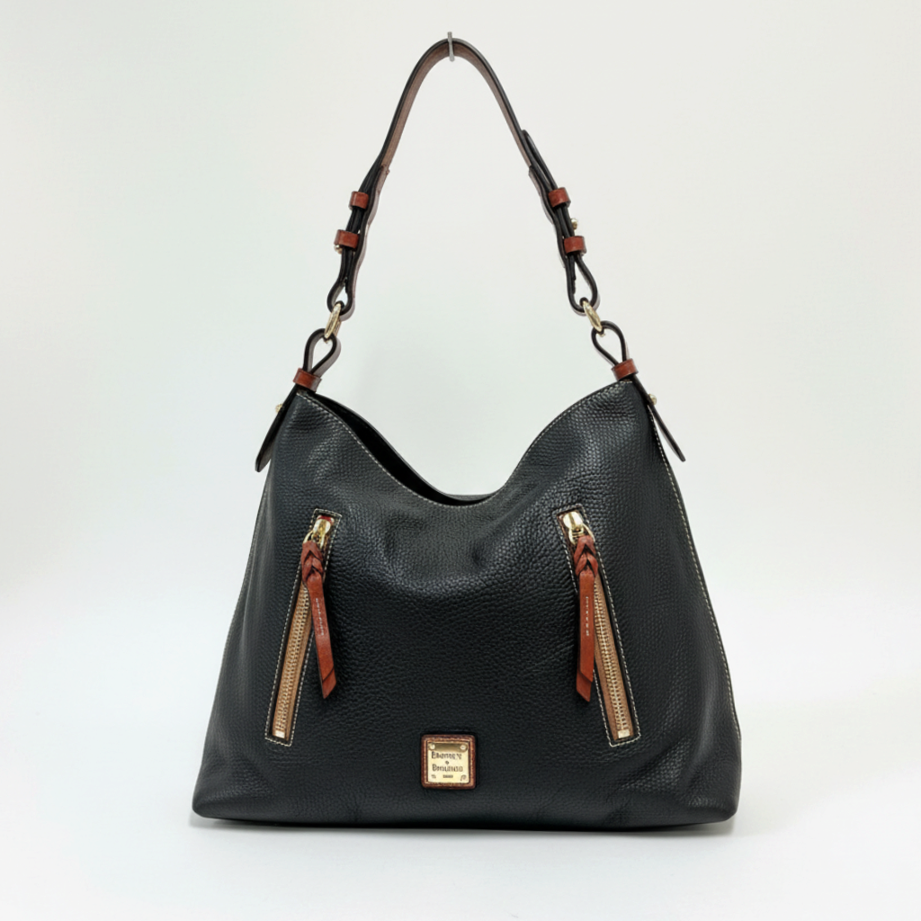 Lynn's Closet Boutique Dooney & Bourke black pebbled leather tote with brown accents, gold hardware, and front pockets.