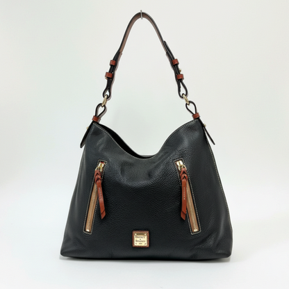 Lynn's Closet Boutique Dooney & Bourke black pebbled leather tote with brown accents, gold hardware, and front pockets.