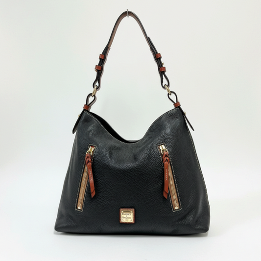 Lynn's Closet Boutique Dooney & Bourke black pebbled leather tote with brown accents, gold hardware, and front pockets.