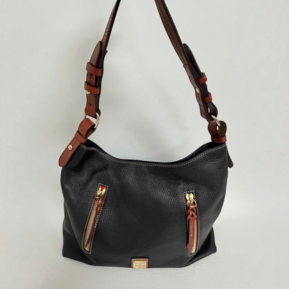 Lynn's Closet Boutique Dooney & Bourke black pebbled leather tote with brown leather accents and front zip pockets.