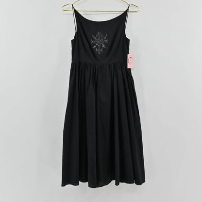 Lynn's Closet Boutique black midi dress with spaghetti straps, gathered waist, and embellished bodice motif.