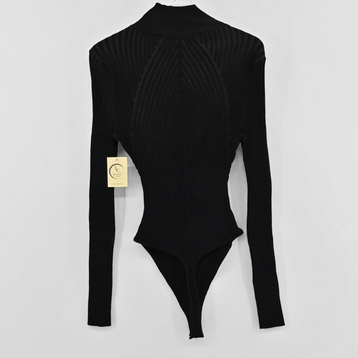 Lynn's Closet Boutique black ribbed sweater bodysuit with a mock neck and long sleeves hanging on a white background.