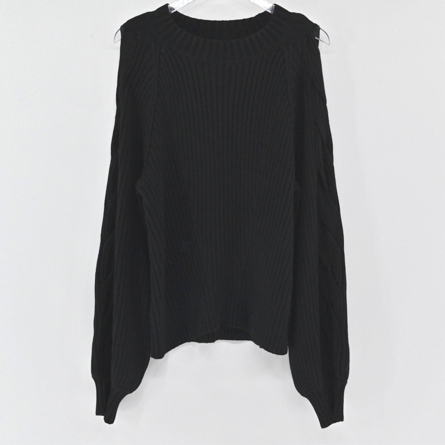 Lynn's Closet Boutique 525 America black ribbed sweater with cold shoulder cutouts and long sleeves.