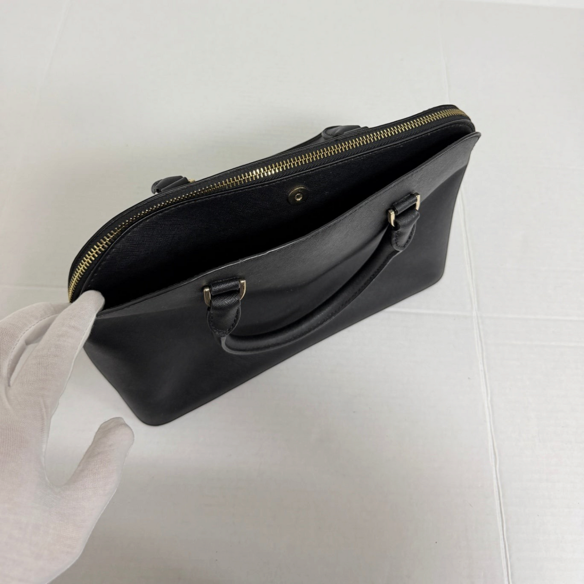 Lynn's Closet Boutique Michael Kors black Saffiano leather dome tote with gold-tone top zip closure and dual handles