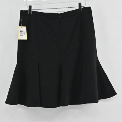 Lynn's Closet Boutique Akris Punto black skater skirt with a flared godet hemline hanging on a hanger