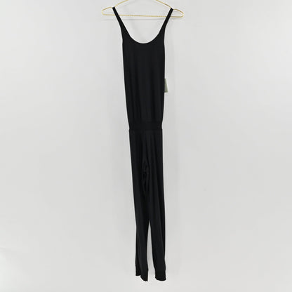 Lynn's Closet Boutique Sweaty Betty black strappy jumpsuit with a scoop back and jogger-style cuffs on a hanger.