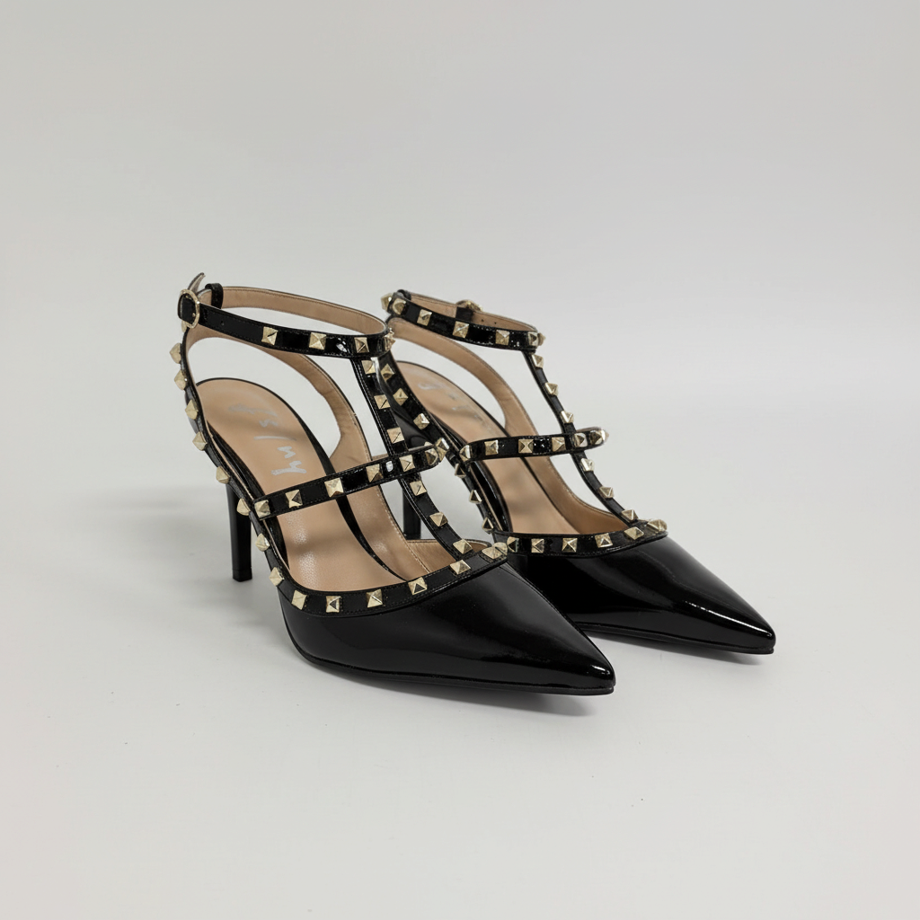 Lynn's Closet Boutique black patent pointed-toe heels with gold pyramid studs and multi-strap cage design.