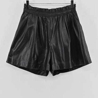 Lynn's Closet Boutique black vegan leather shorts with a high-waisted paperbag elasticated waistband and side pockets.