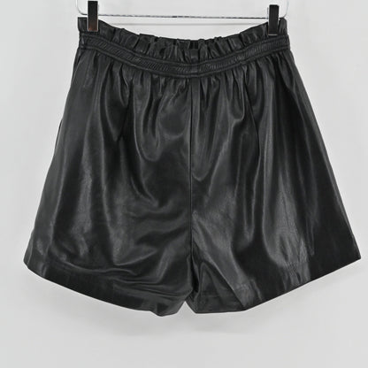 Lynn's Closet Boutique black vegan leather shorts with a high-waisted paperbag elasticated waistband and side pockets.