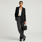 Lynn's Closet Boutique Banana Republic black wool double-breasted blazer with gold buttons worn by a model